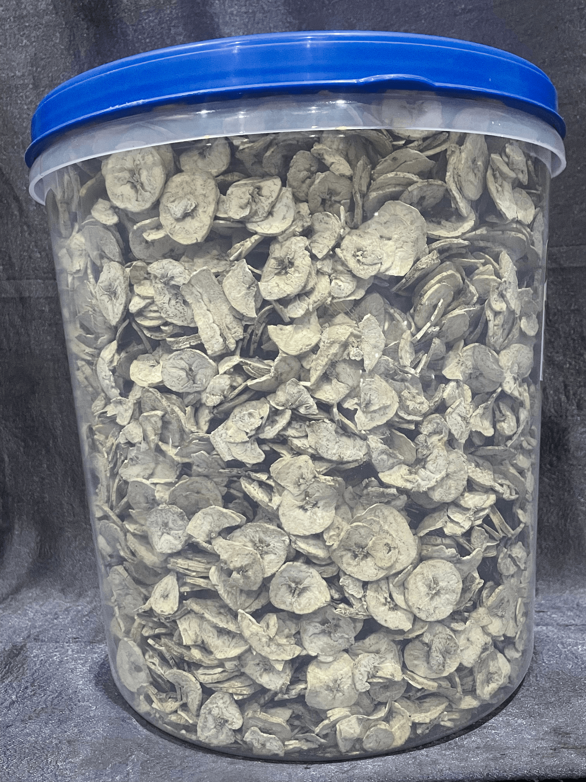 Dried unripe plantains in a 12.5L container